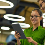 Man and woman talking with tablet