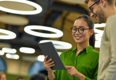 Man and woman talking with tablet